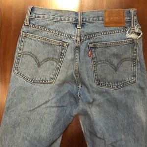 Levi’s wedge small hole near belt loop on back.